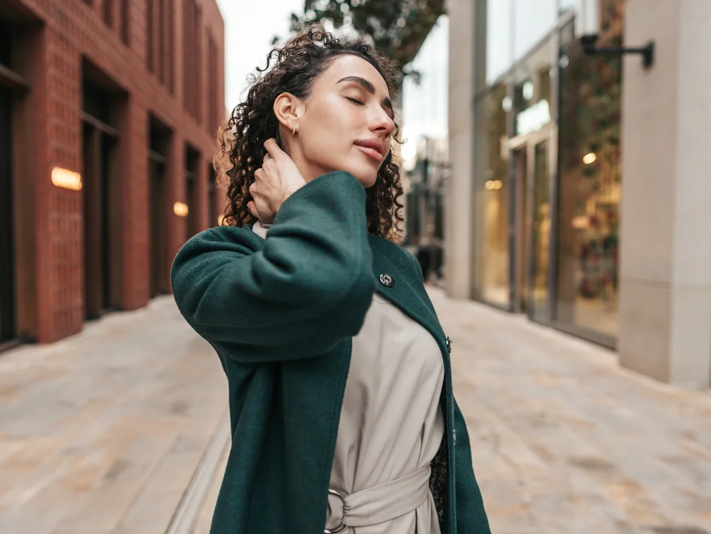 Woman walk down city street