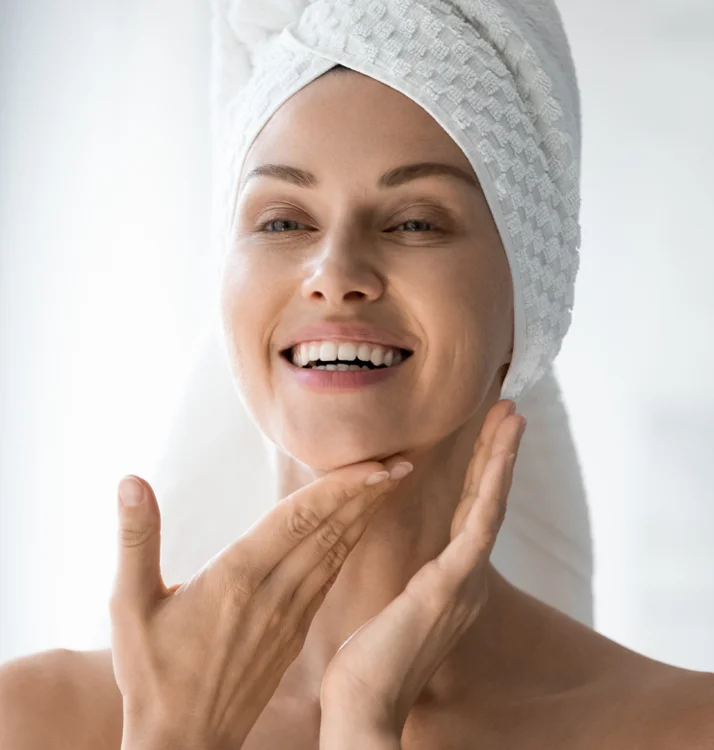 Woman touching her chin - Facials